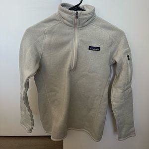 Women’s oatmeal colored Patagonia half zip.